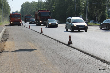 На дороге от Вазюка до Опарино в Кировской <b>области</b> укладывают выравнивающий слой